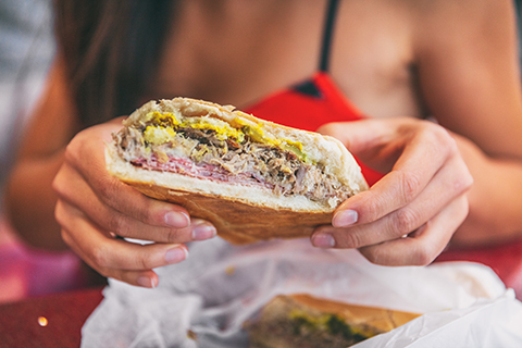 A stock photo. A zoomed in view of a traditional Cuban sandwich.