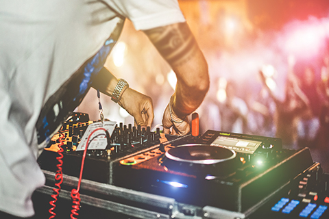 A stock photo. A zoomed in view of a DJ's turntables.